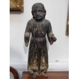 An 18th Century Pacific Origin painted wood figure of a saint,