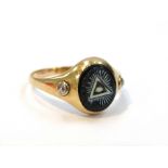 A gold 19th Century Masonic ring set with two diamond chips, marks rubbed. Size S/T, 4.