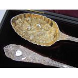 A pair of Mappin & Webb silver plate berry serving spoons,
