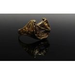 A 9ct gold equestrian ring designed with horses head in horse shoe. Size V, 4.