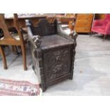 A Victorian carved oak coal scuttle with lion mask detail,