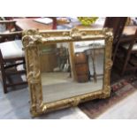 A 19th Century gilt gesso framed wall mirror with acanthus motifs,