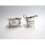 A silver cream jug and sugar bowl by Lee & Wigfull, both monogrammed, Sheffield 1896,