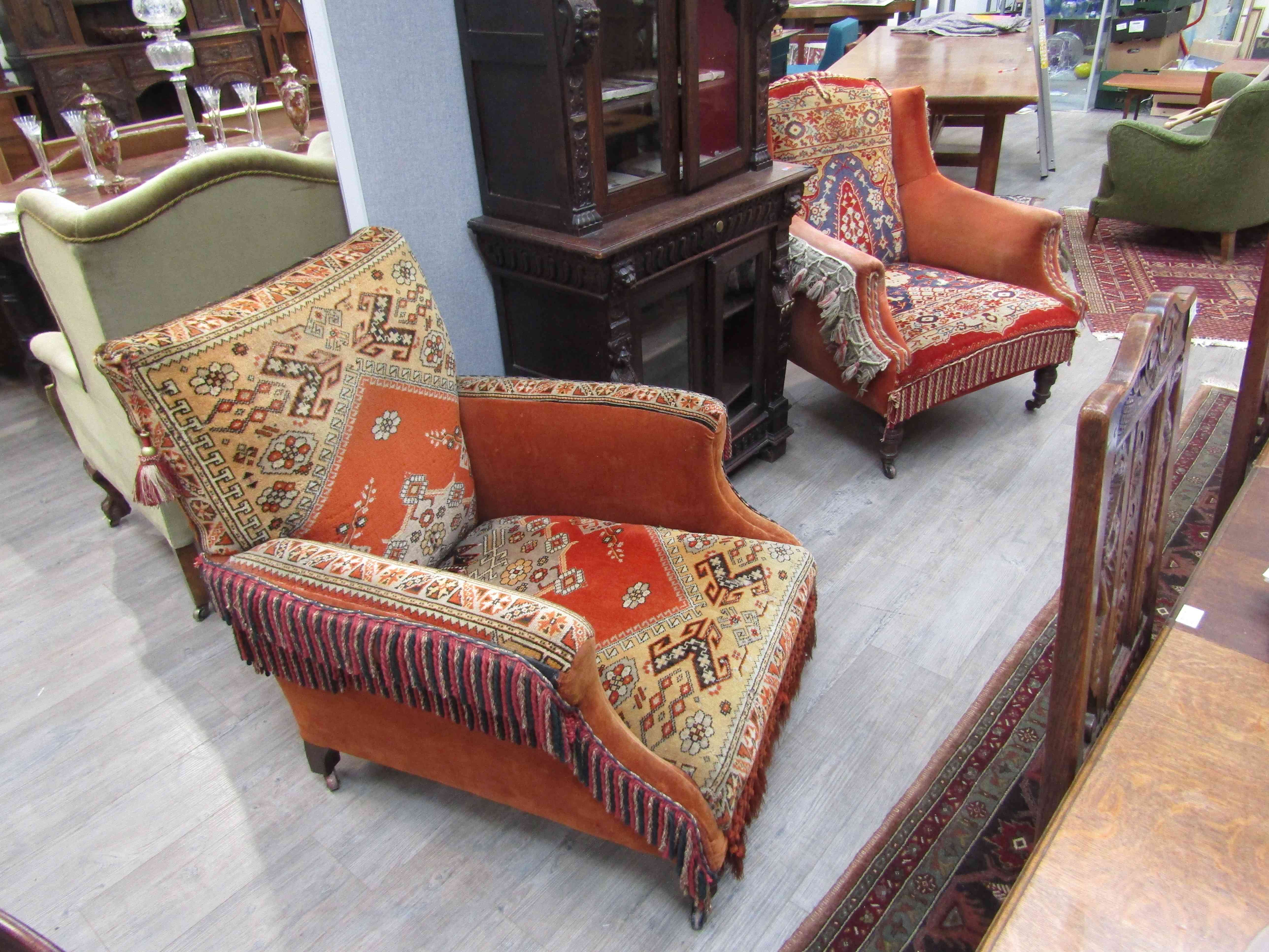 Two Victorian carpet chairs with tasselled borders,