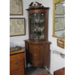 An Edwardian mahogany glazed corner cabinet with parquetry detail,