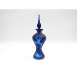 An Okra glass perfume bottle, iridescent blues with dancing figures.
