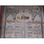 An Admiral Fitzroy barometer with paper charts,