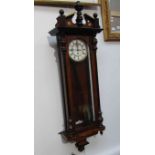 A Vienna wall clock with pendulum and weight,