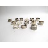 14 silver napkin rings of varying styles, shapes and designs,