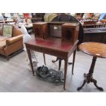 An Edwardian Bonne-de-jour desk with galleried and cupboard back, leather inset top two drawers,