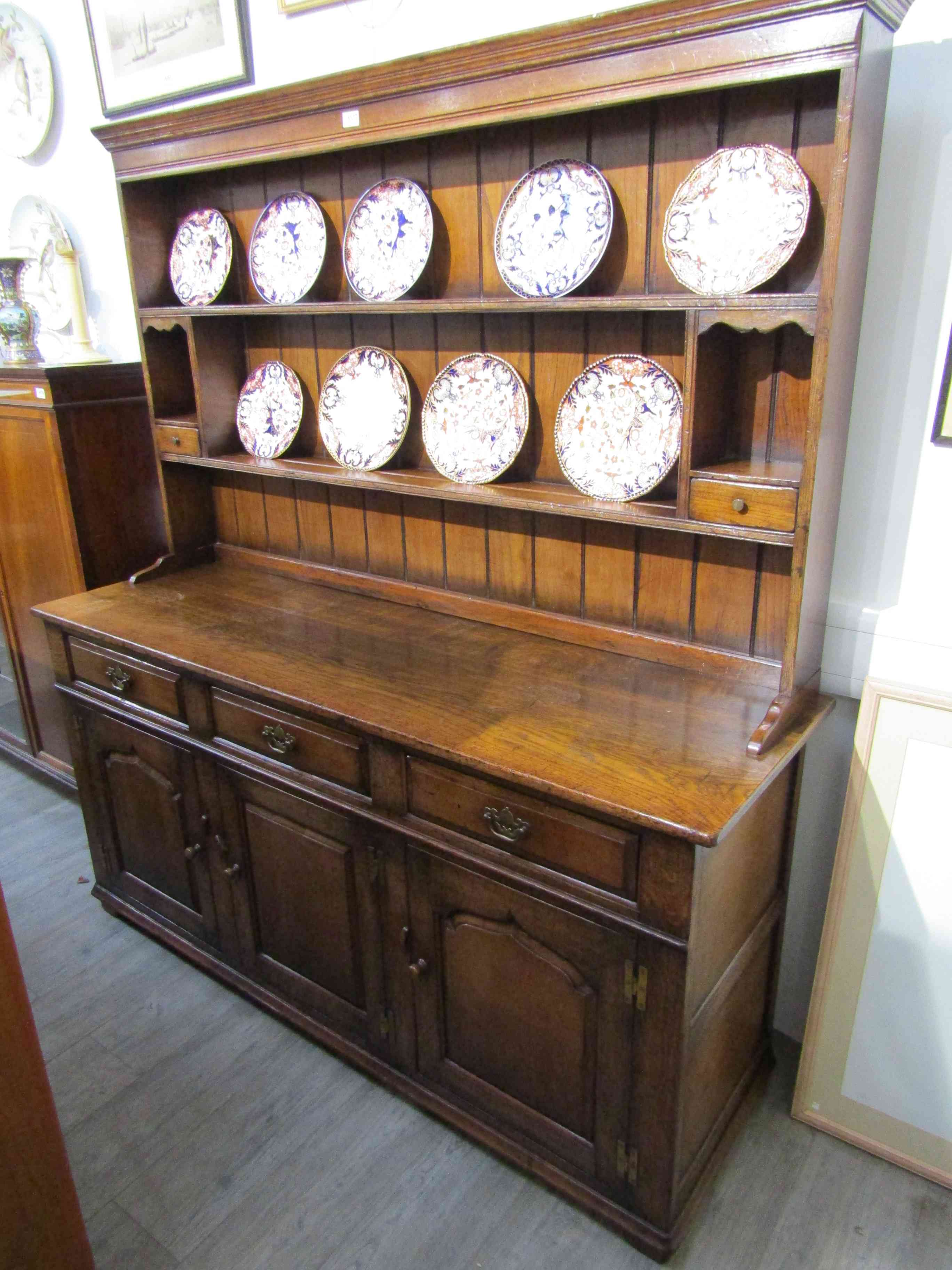 A Titchmarsh & Goodwin 17th Century style oak dresser and rack (RL19855),