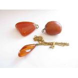 Three various amber pendants