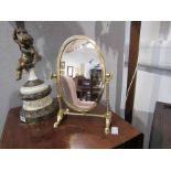 A brass dressing table swing mirror with turned supports on faceted feet (Mirror approx 27cm,