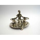 A silver plate pipe stand with African American figure with presentation inscription,