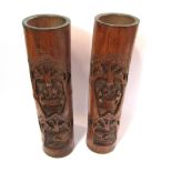 A pair of carved bamboo containers with figural and boating scenes