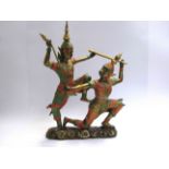 A 20th Century cast Thai sculpture depicting Yaksha with handpainted colourful embellishment 50cm x