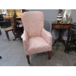 An Edwardian floral upholstered armchair,