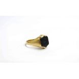 A gold ring with carved intaglio, stamped 18ct. Size O, 6.