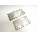 Two silver cigarette cases, engraved, 14cm and 17cm long,
