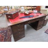 A large leather topped partners desk,