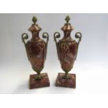 A pair of Italian rose marble urns with brass mounts,