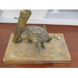 A bronze figure of trapped boar on base,