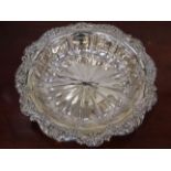 A late Victorian silver bowl, shaped edge with scrolled foliate relief,