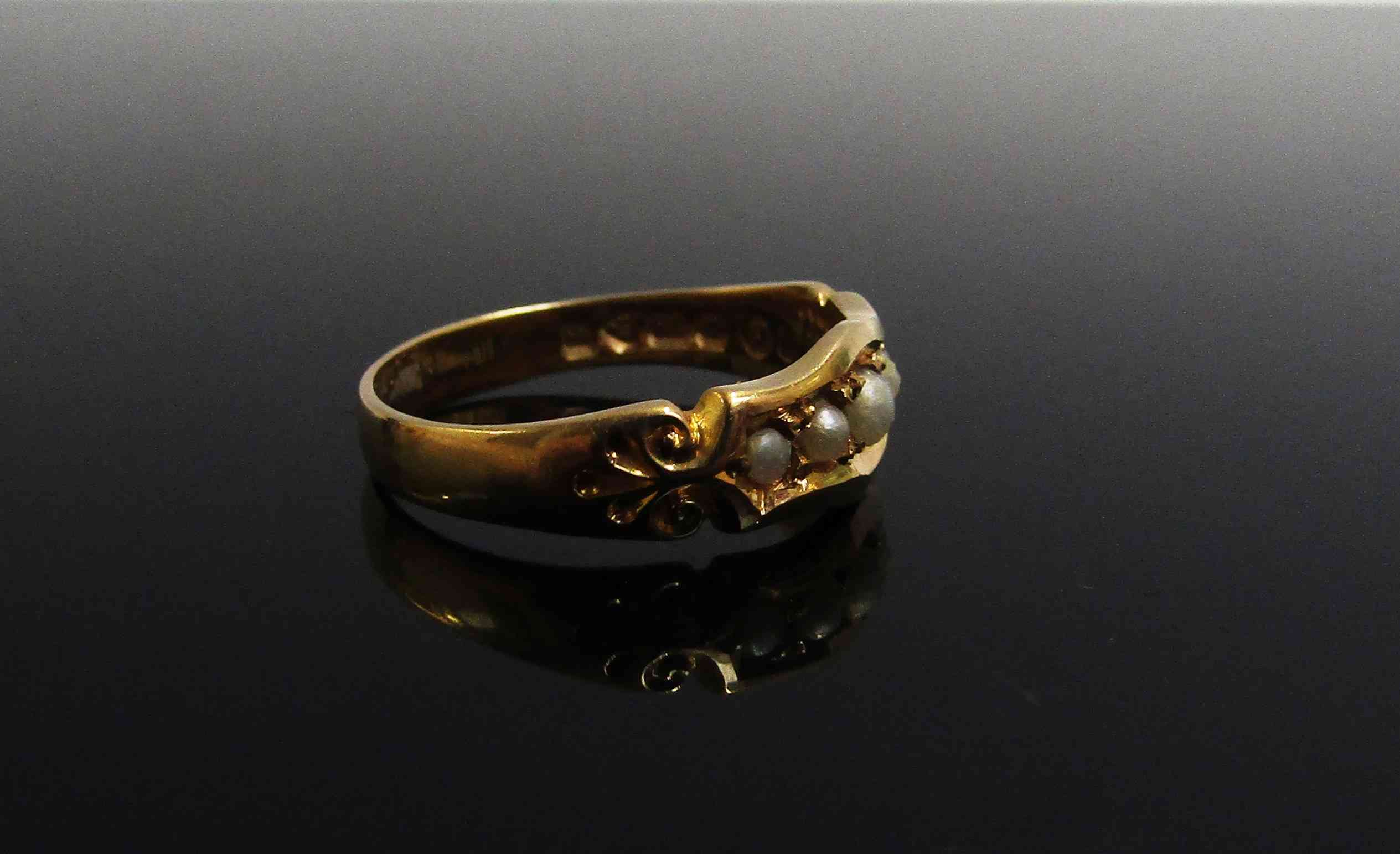 An 18ct gold ring set with five pearls in ornate setting. Size N, 3. - Image 2 of 2