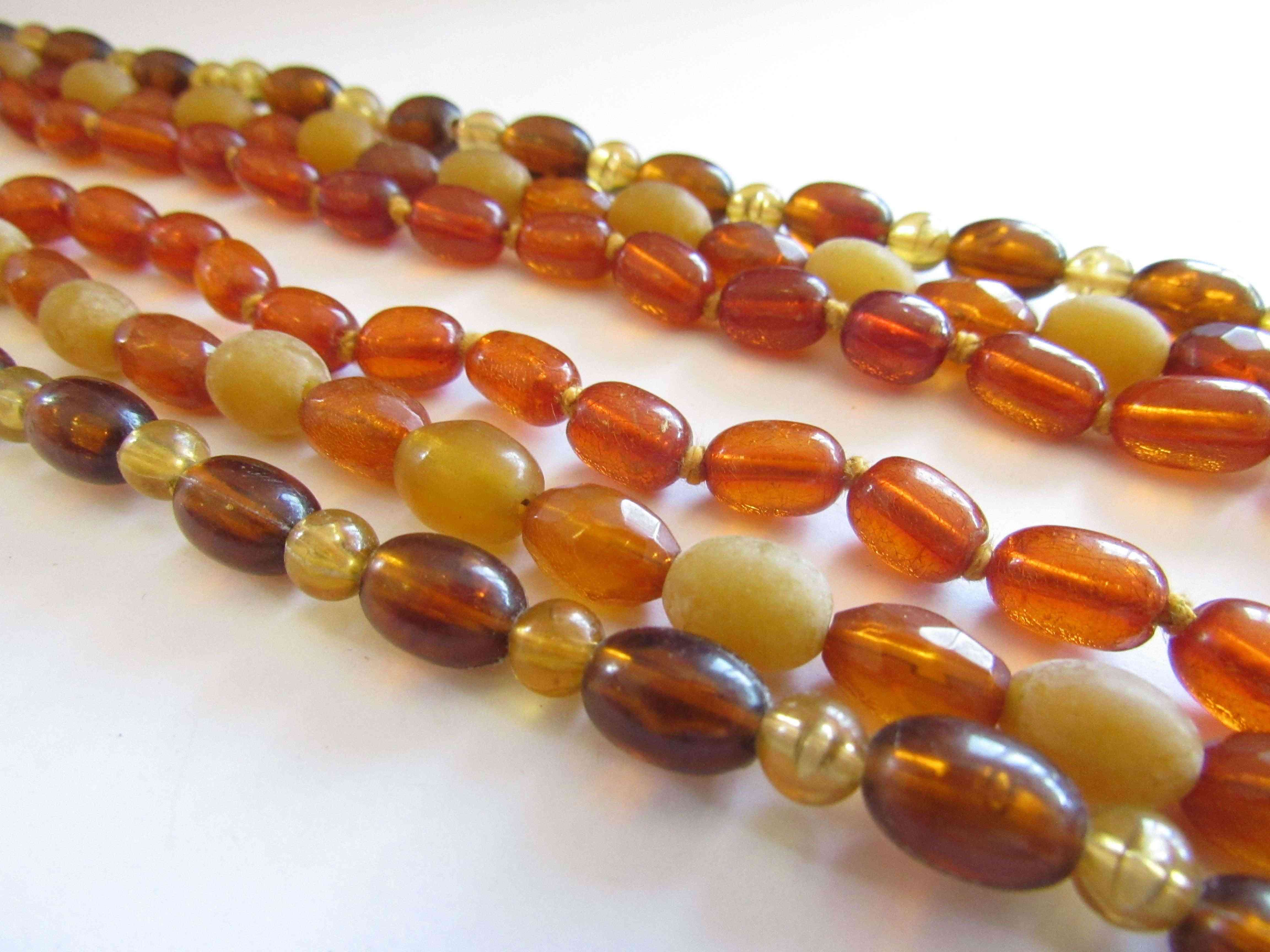 Three amber necklaces,