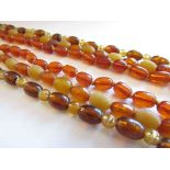 Three amber necklaces,