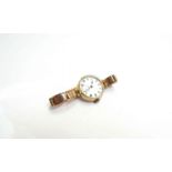 A 9ct gold cased and strapped wristwatch, 26.