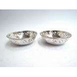 A pair of Haseler silver pierced dishes of circular form, Birmingham 1923, 10cm diameter,