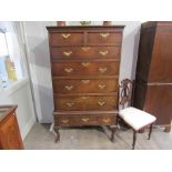 A Georgian oak chest on stand, two over four drawer top on three drawer base,