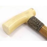 A Victorian malacca walking cane with silver band, vacant cartouche, ivory handle,
