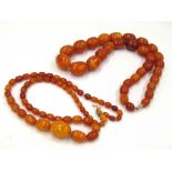 Two amber bead necklaces, 52cm, 52.9g and 56cm, 18.