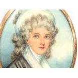 An early 19th Century oval miniature on ivory, portrait of a woman. Unsigned.