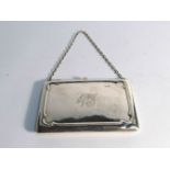 A rectangular silver purse with silk lined sectional interior, Birmingham 1913, marks rubbed, 10.