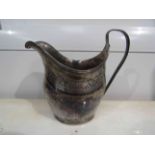 A George III silver milk jug, later engraved, makers mark rubbed, London 1800,
