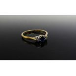 An 18ct gold platinum set diamond and sapphire ring. Size R/S, 2.