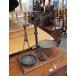 A set of weighing scales with weights,