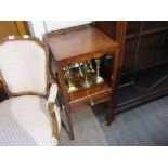 An Edwardian mahogany bedside table,