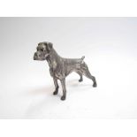 A silver filled figure of a boxer dog,