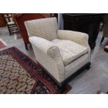 A late Victorian armchair with ball and claw feet,