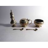 A silver three piece cruet set comprising mustard, salt and pepperette, London 1940,