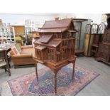 A 19th Century style pagoda form fruitwood birdcage, on freestanding base,