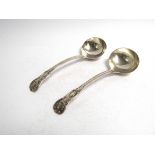 A pair of silver ladles, London 1837 with scallop detail, monogram to reverse of handle,