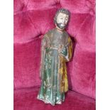 An 18th Century Pacific Origin painted wood figure of a saint,