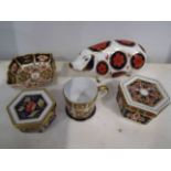 A Royal Crown Derby Imari pig with moulded stopper together with two hexagonal sided trinket boxes