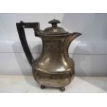 A silver hot water jug with gadrooned rim, ball feet, Birmingham 1904,
