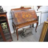 An 18th Century and later walnut and mahogany bureau, marquetry fall flap,